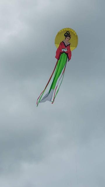 eChang the Moon Goddess in flight over a Norfolk beach.