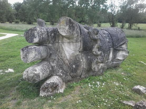 a sculpted stone hand that was lying near a stone head and a stone foot, pretending to be ruins of a 10+ m high standing stone giant.