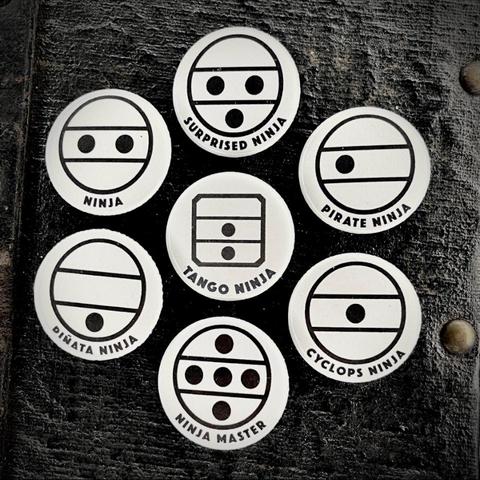 Various accordion/organ register switch symbols with their circles, dots and lines. With humorous subheadings joking on how the dots make them look like little ninja faces with various expressions. “Ninja,” “Surprized Ninja,” “Pirate Ninja” (has one eye) etc. A “Tango Ninja” has a square box around it rather than round, and the low/middle ‘bandoneon’ reed symbol).