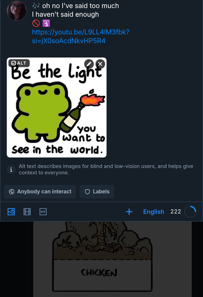Cute anime frog holding an alight Molotov cocktail aloft "be the light you want to see in the world"
