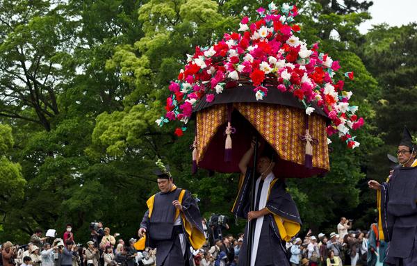 Participants in the Aoi Matsuri wear wild ginger leaves on their hats or clothing.