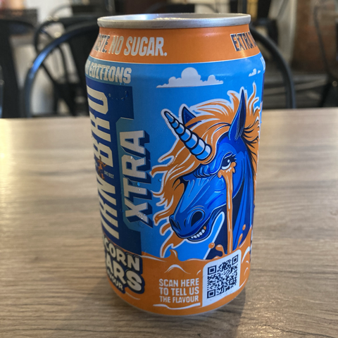 A can of Irn-Bru in its distinctive orange and blue colours, with a blue unicorn with an orange mane