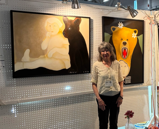 I’m standing in front of 2 of my paintings from my Bear series