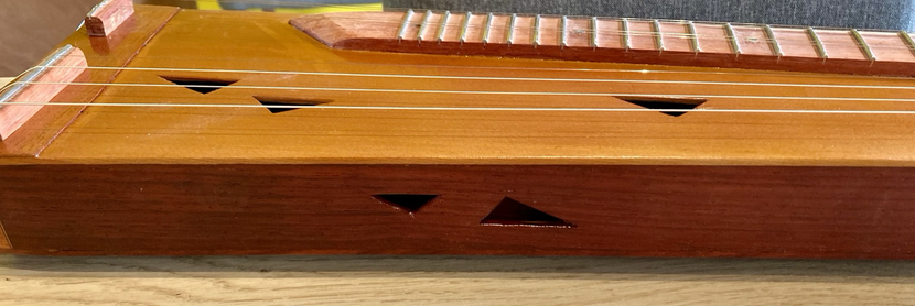 Sound hole on the side of the instrument 
