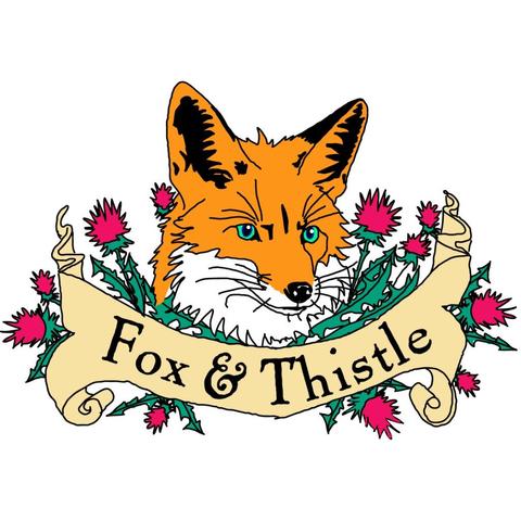 A fox in the thistle, with a rolled out banner stating as much.