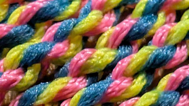 Yellow, pink, and blue yo-yo string