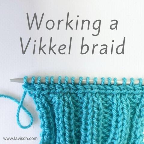 A turquoise swatch in 2x2 rib, on top of with a Vikkel braid is visible, just beneath the knitting needle.