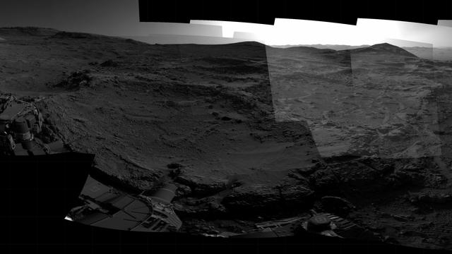 A mosaic of grey scale images capturing a Martian landscape.
Credit: NASA/JPL-Caltech