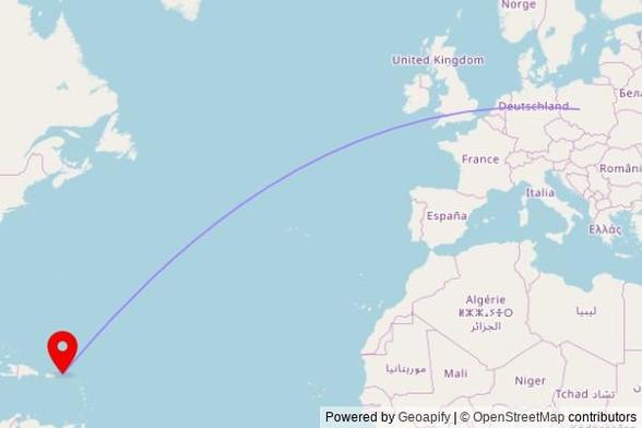 A map showing the great circle route from Chocz in Poland to a map pin at St. Williams Catholic Church, 143 Main Street, Road Town, British Virgin Islands, VG1110