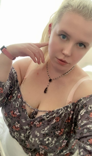 Selfie of Queen in a floral top