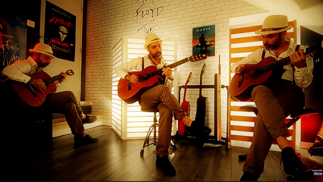 Soul Machine on the same picture 3 times playing the guitar in different postures.