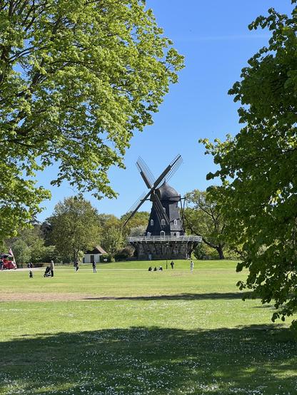 View over the park towards a windmill.