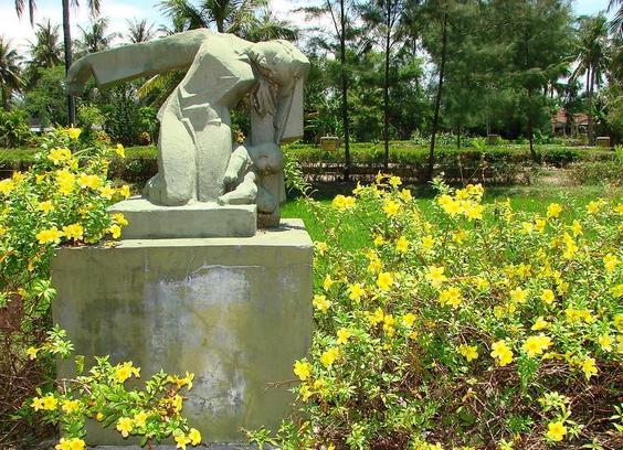 A poignant monument now stands beside a farm ditch where US soldiers shot to death over 150 civilians during a massacre of 504 women and children and old men of the small hamlet of My Lai, in Vietnam. on 16 March 1968. The 'Son My Memorial Site' is located 2 hrs drive south of Da Nang in central Vietnam. 

The village is gone but the foundations of their houses and shelters remain along with the ditches, fields, and original paths in the village. The paths are now paved concrete with embedded representations of footprints of the victims and their killers. 

In an act of memory, accountability and reconciliation, the museum at the site includes a wall with the names of the 504 victims, as well as an extensive photo and document gallery which includes extracts from the US military investigations, contemporary news articles, and recent interviews with soldiers and survivors.

 (Photo: Adam Jones/Global Photo Archive/CC by 2.0)