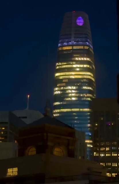 Salesforce Tower in San Francisco. At the top is a video of lots of purple basketballs bouncing around in honor of the new women’s basketball team the Valkyries.