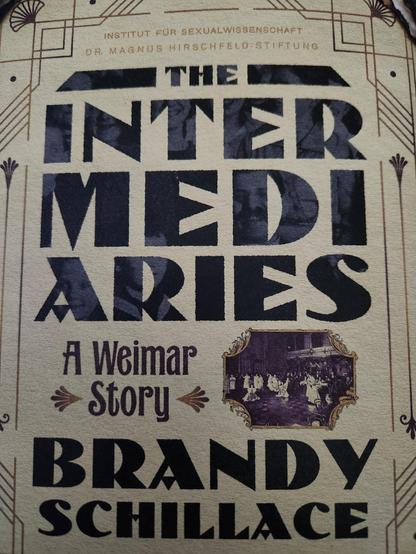 Art Deco front cover of The Intermediaries: A Weimar Story by Brandy Schillace
Sepia, black lettering, fake burns around the edges