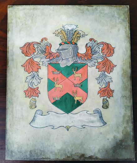 the design on wooden board, some color added, reds and greens and silver and gold 