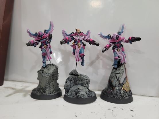 Three flying battle sisters in pink and blue