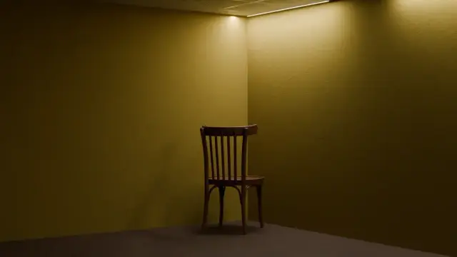  The image depicts a simple, empty room with yellow walls and a gray floor. The room is minimally furnished, with a single wooden chair positioned in the center, slightly off-center to the right. The chair has a classic design with vertical slats on the backrest and a curved top rail. The lighting in the room is subdued, with a strip of light running along the ceiling, casting a soft glow on the walls and floor. The overall atmosphere is quiet and unadorned, with no additional objects or decorations visible in the space.

Provided by @altbot, generated privately and locally using Ovis2-8B