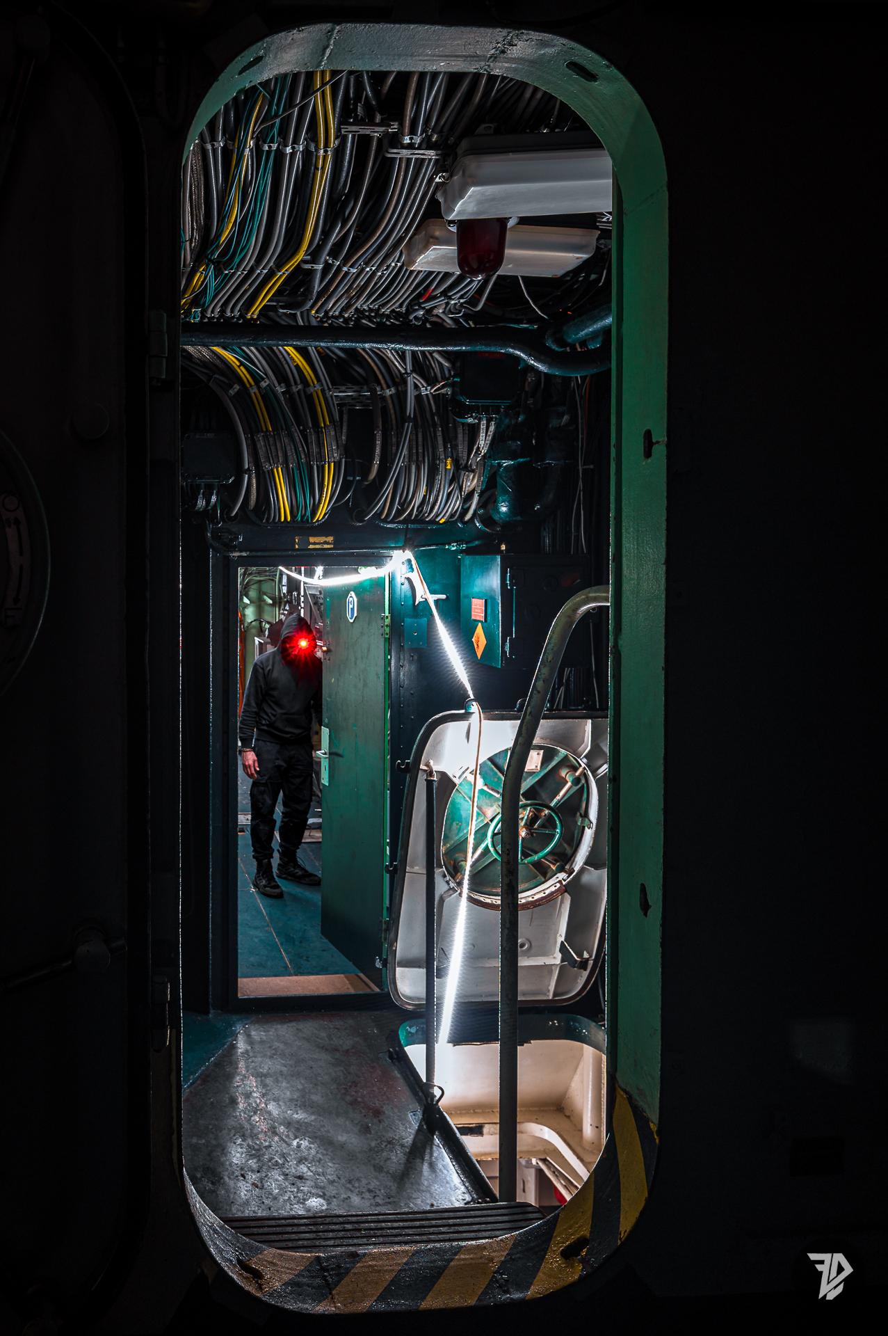 silhouette in the corridor of an abandoned military ship silhouette in the corridor of an abandoned military ship