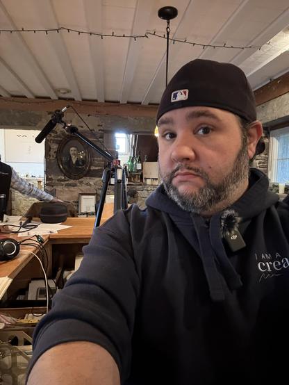Joe Casabona in selfie with the podcast recording equipment in the background.