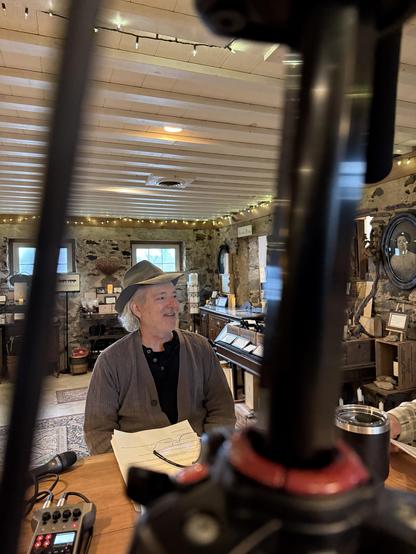 Anthony Vietri of Va La Family Vineyards sits at his bar recording a podcast episode.