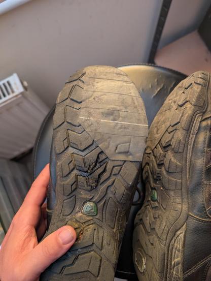 Photo of a pair of shoes with a rubber glued to the sole.