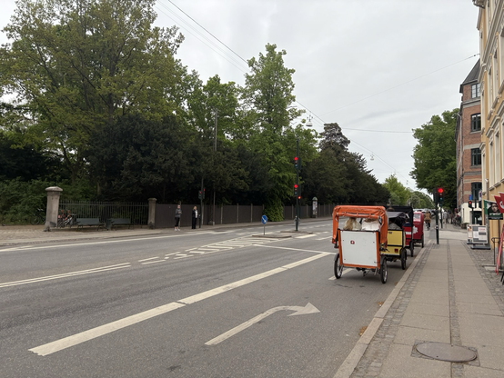 Bike taxis at one of the gates to Frederiksberg Have - in the absence of cars, resembling horse carriages - mirroring the 1890’s architecture of the scene.