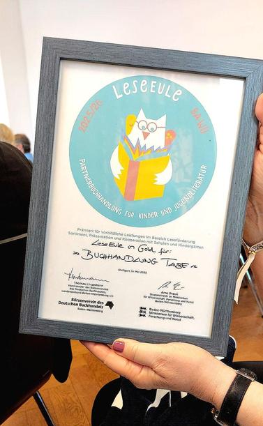 Urkunde der "LeseEule" für die Buchhandlung Taube