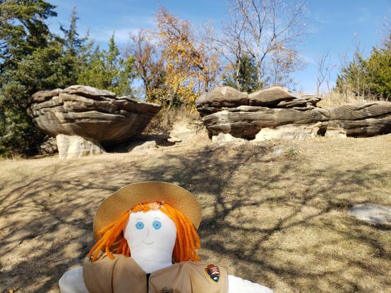 Ranger Sarah views some other rocks that might become mushroom rocks in the future. Two mushrooms and a giant shoe rock, as well as numerous other rock formations, are in the 5-acre park.
— at Mushroom Rock State Park.
