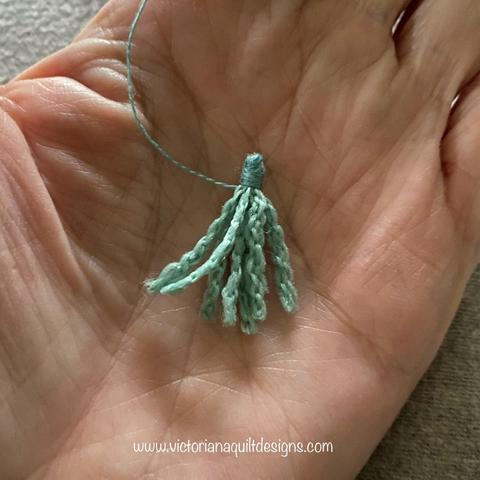 Tiny teal tassel. 