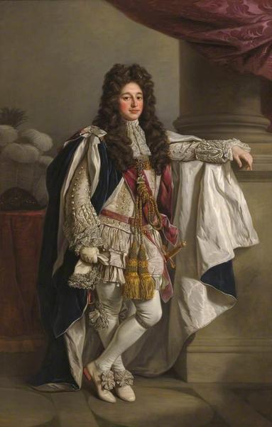 a  painting of a vey elegant and extravagantly dressed man in a palace, his arm resting on a column he has a large chocolate brown wig on and vey ruffled sleeves, white shoes with heels on them, white stockings, the man went all-out. large gold ropes hanging , tassles at the end of them from his chest, he is looking at the viewer with a calm expression 