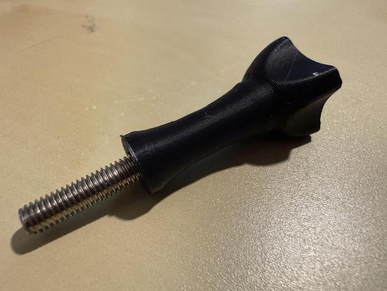 The thumb screw handle with the original bolt installed (and superglued so it doesn’t come out).