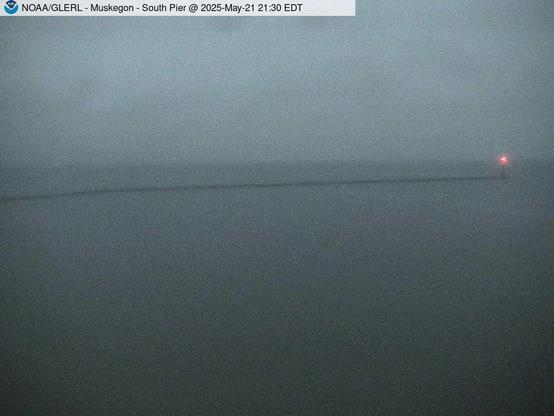 Wide view of the Muskegon channel southern breakwater stretching into Lake Michigan. // Image captured at: 2025-05-22 01:30:01 UTC (about 6 min. prior to this post) // Current Temp in Muskegon: 48.45 F | 9.14 C // Precip: light rain // Wind: N at 9.216 mph | 14.83 kph // Humidity: 96%