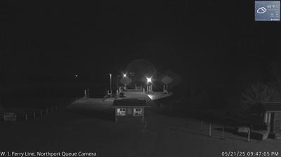 A small security building in the foreground leading into the Liberty Grove ferry docking area and Lake Michigan in the background. // Image captured at: 2025-05-22 02:47:44 UTC (about 18 min. prior to this post) // Current Temp in Liberty Grove: 48.57 F | 9.21 C // Precip: overcast clouds // Wind: N at 10.357 mph | 16.66 kph // Humidity: 81%