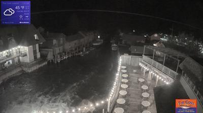 View of the outdoor dining area for The Cove Restaurant and the larger Fishtown complex overlooking a channel leading to Lake Michigan. // Image captured at: 2025-05-22 05:37:56 UTC (about 28 min. prior to this post) // Current Temp in Leland: 50.34 F | 10.19 C // Precip: overcast clouds // Wind: NNW at 4.004 mph | 6.44 kph // Humidity: 72%