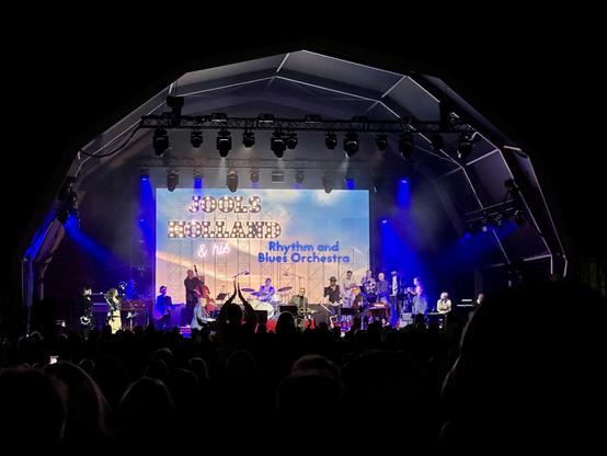 Jools Holland & his Rhythm and Blues Orchestra on stage with Chris Difford.
