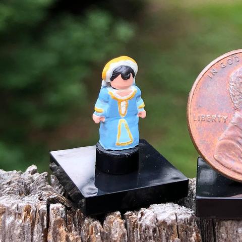 A LEGO nanofig\statuette customized to look like Cassandra from Tangled the Series.
