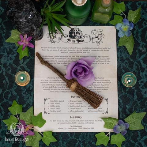 A page of black text is printed on a piece of antiqued paper and laid flat on a lace-covered surface. Its title is "Dark Moon" and is meant to be incorporated into a Book of Shadows or other journal. It details some information about the Dark Moon phase as well as Dark Moon practices and deities. This is an exclusive product from Inked Goddess Creations.