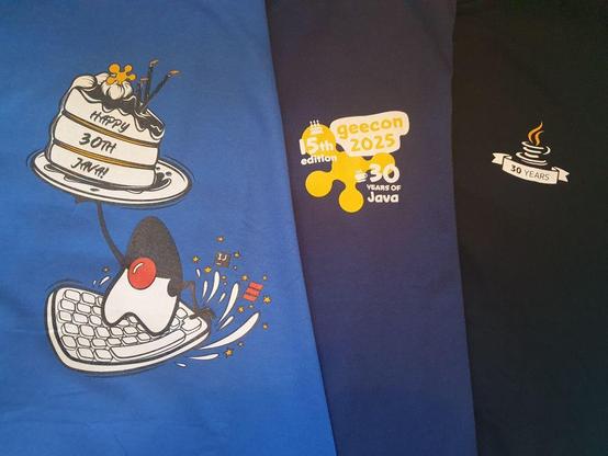 Three t-shirts: A blue one with Duke holding a birthday cake with the text "Happy 30th Java", a darker blue one with the GeeCON logo surrounded by the text "15th edition, geecon 2025, 30 years of Java" and a black one with the official Java logo and the text "30 years" in a banner.