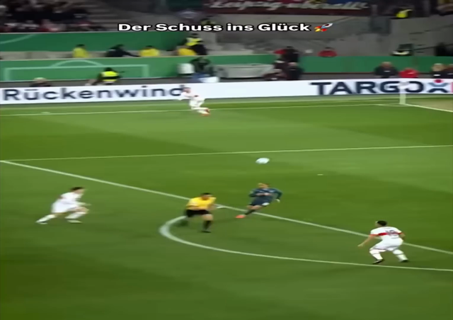 Angelo Stiller scoring the first goal with a beautiful volley in the semi-final of the DFB-Pokal agains Leipzig. He then runs towards the fans and is disappearing in a crowd of celebrating players and fans.