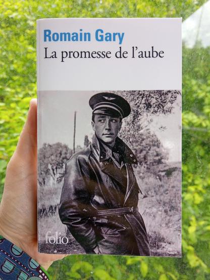 Book; La promesse de l'aube by Romain Gary. On the cover a photograph of the author wearing the outfit of a French air force pilot, as it looked during the second world war. 