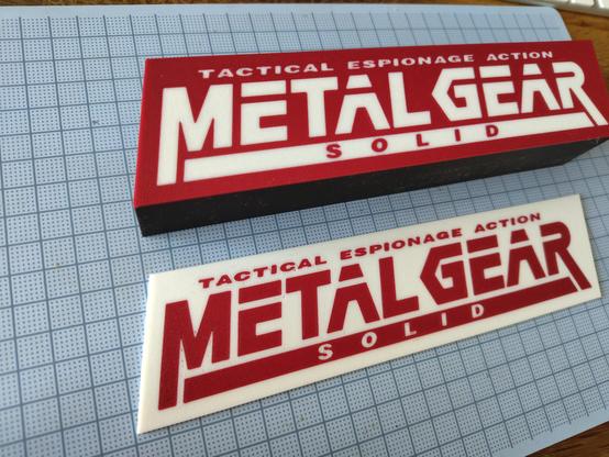 Another printed lightbox with the logo of Metal Gear Solid