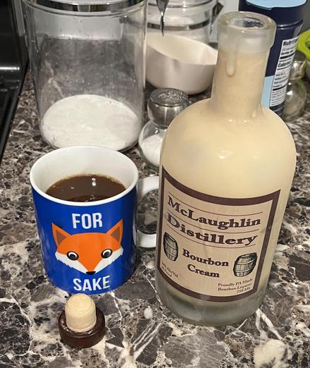 Coffee mug and bottle of bourbon cream