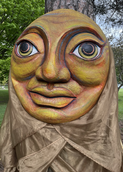 A big smiling puppet face