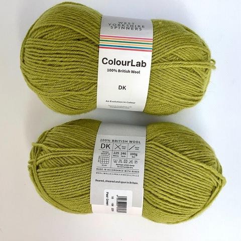 2 peer green balls of yarn on a white background.