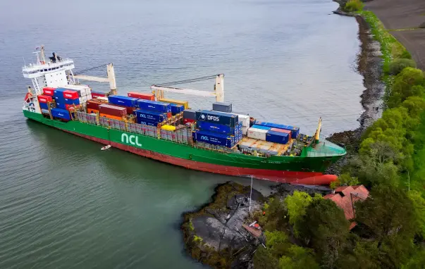 The 135-metre container ship NCL Salten ran aground just before 5am on Thursday, almost hitting a house in the Trondheim fjord outside Byneset on its way to the western town of Orkanger. A Norwegian man spoke of the ‘unreal’ moment he woke up to discover that the ship had crashed into his front garden.

Photograph: Jan Langhaug/EPA