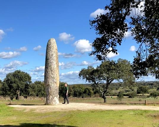A photo of the 7.5m tall Menir da Meada with me beside it for scale