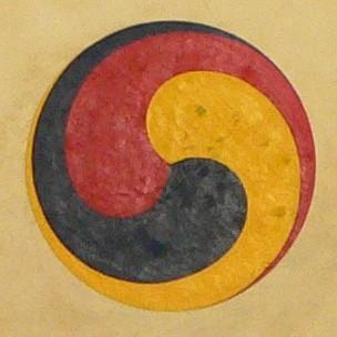 The gankyil (Tibetan) or “wheel of joy” (Sanskrit: ānanda-cakra) is a symbol and ritual tool used in Tibetan and East Asian Buddhism. It consists of three whirling and interconnected blades. It often constitutes the wheel hub in the Dharma Wheel (dharmachakra), symbolizing the Three Marks of Existence: impermanence (anicca), suffering (dukkha), and non-self (anatta). Source: Wikimedia Commonsꜛ (license: CC BY-SA 2.0)