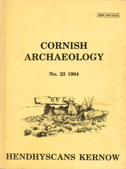 The front cover of Cornish Archaeology No 23 for 1984. Plain pastel yellow with title in black, in English and Kernewek, and with an illustration of Pawton Quoit, a chambered tomb near St Breock in Cornwall.