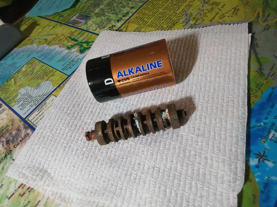 Metal object next to a D cell battery for scat